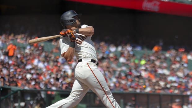 SF Giants left fielder LaMonte Wade Jr. swings for the fences at Oracle Park (2023).